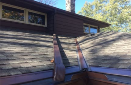 Mansard Brown valley and eave panels match home color