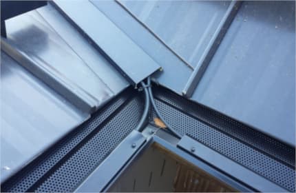Self regulating heat cable installed in radiant panel on roof valley and gutter guard