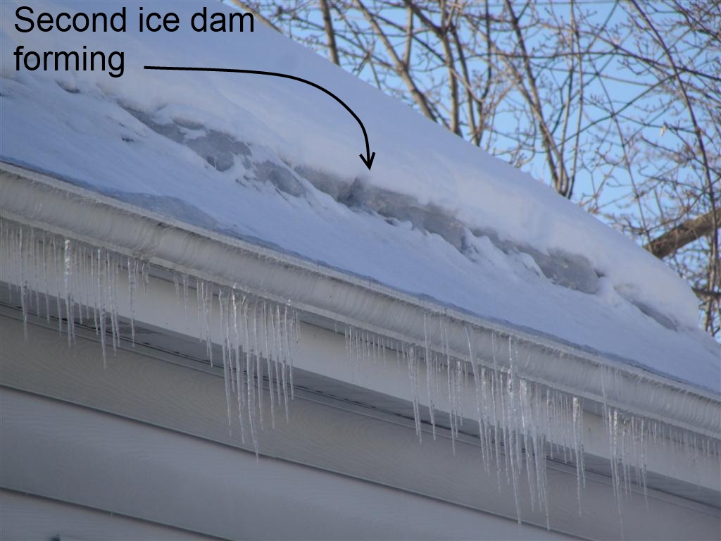 Image of a Double Dam atop a home