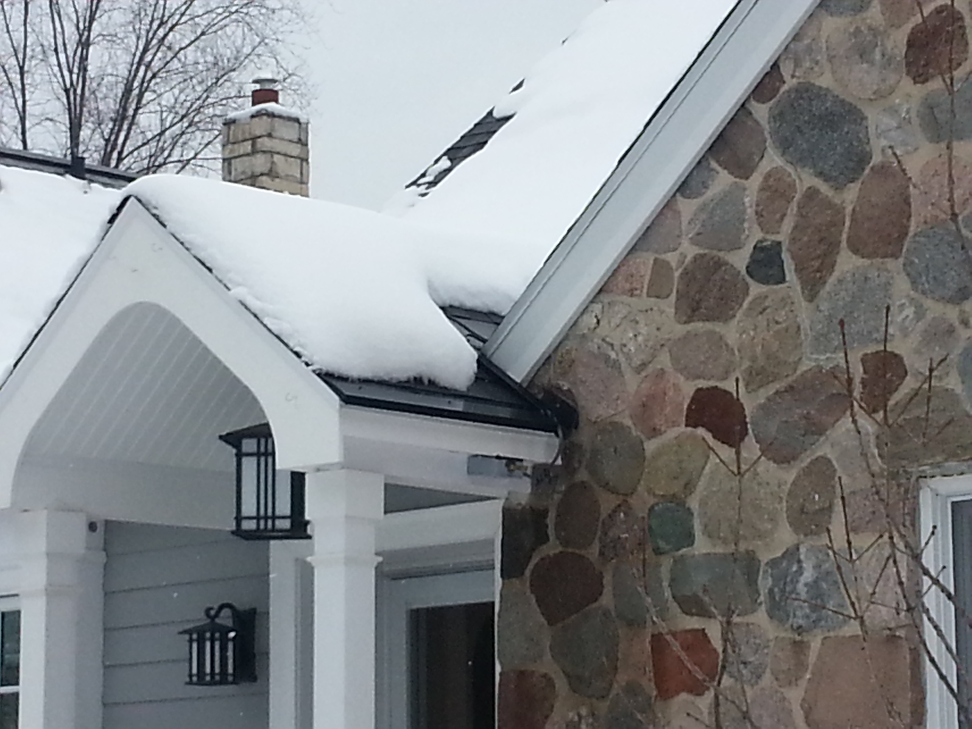 Roof and Gutter Ice Dam in valleys in Wauwatosa, Wisconsin