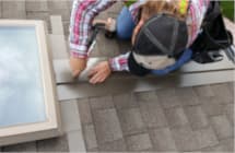 Installing a heated specialty panel around a skylight roof window in Southeastern Wisconsin